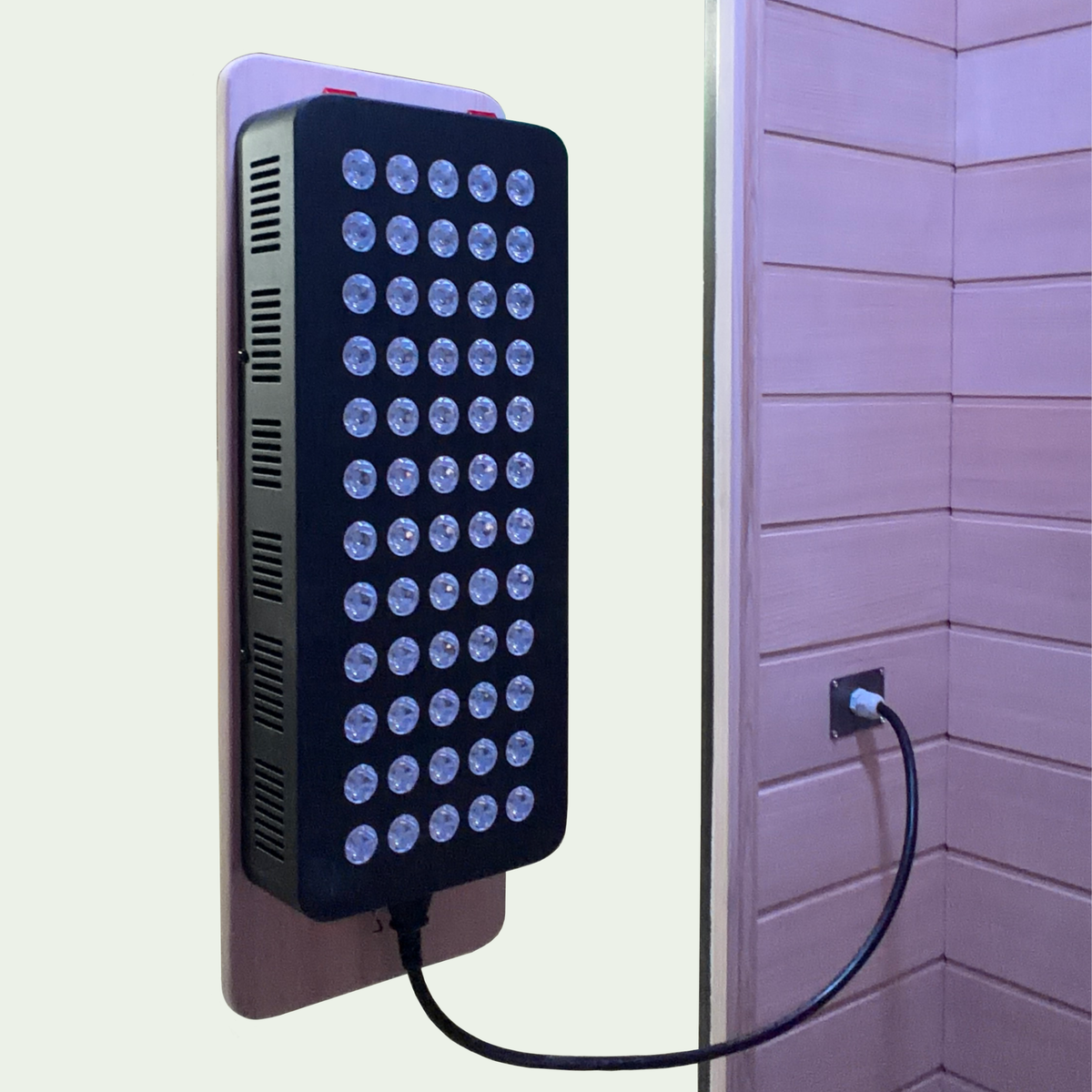 Front-facing red light therapy panel installed inside Blisspod Malmo sauna