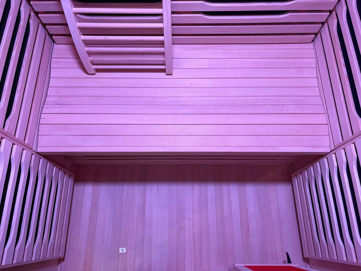 Interior wooden bench and heater guards inside the Blisspod Milano infrared sauna
