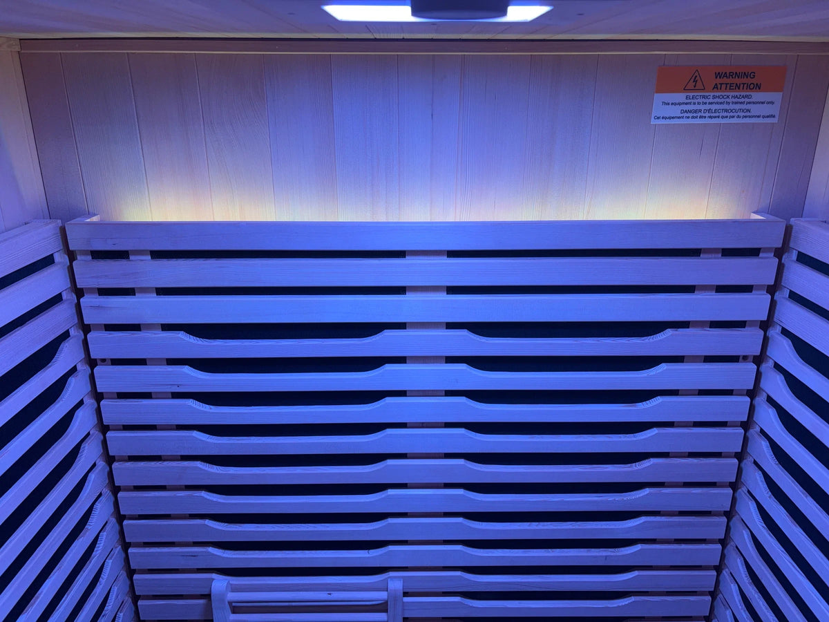 Blue LED accent lighting illuminating the interior ceiling of the Blisspod Milano sauna
