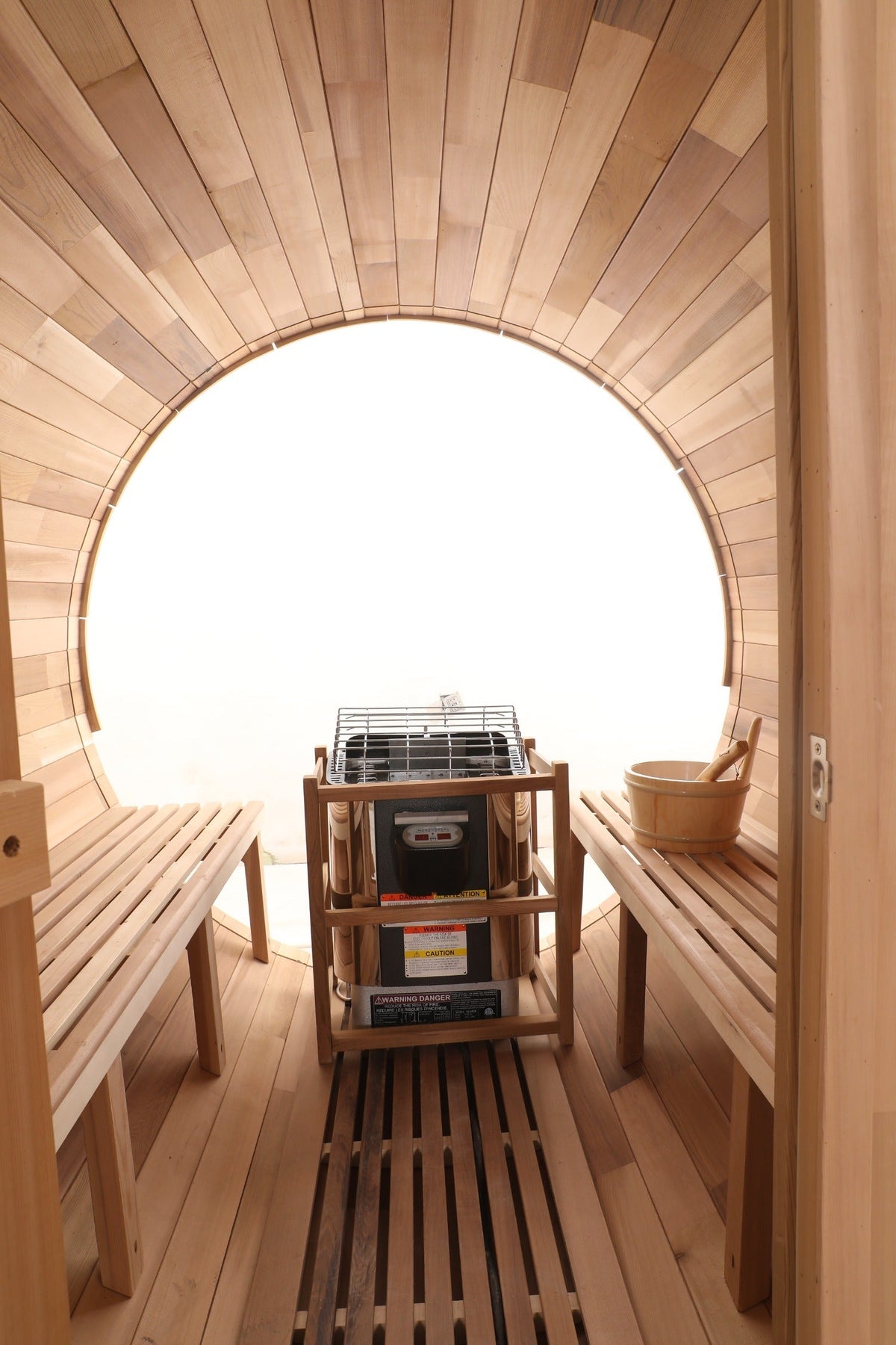 Blisspod Prague sauna interior showing cedar benches, electric heater and full glass back