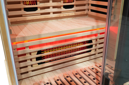 Interior bench and wooden heater guards inside the Blisspod Vantaa RED sauna

