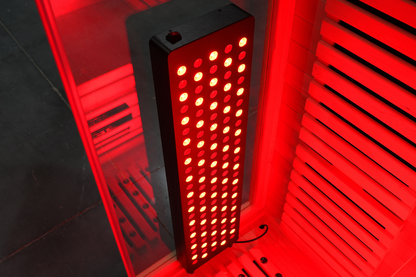 Illuminated red light therapy panel inside the Blisspod Venetian RED infrared sauna
