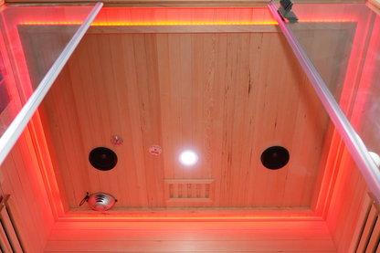 Interior ceiling of the Blisspod Venetian RED sauna showing red lighting and circular fixtures