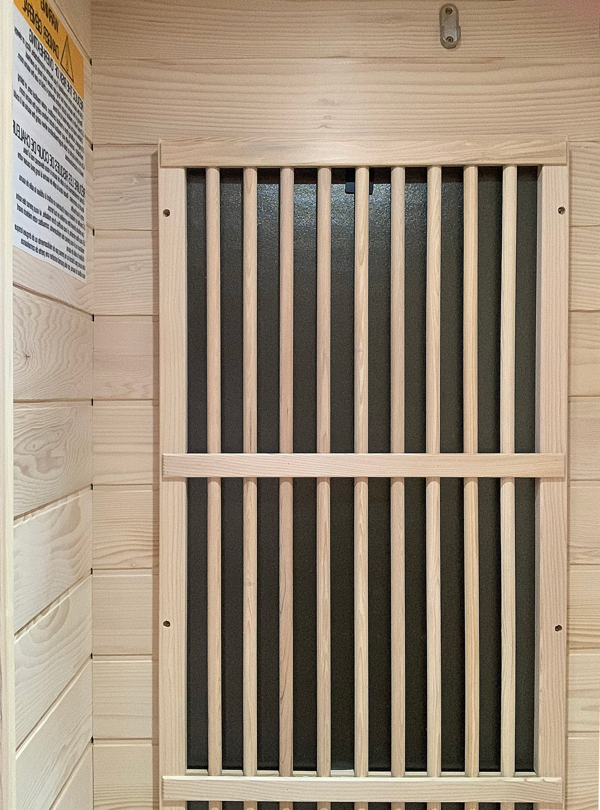 Wooden protective guard over infrared heating panel inside Blisspod Vienna sauna
