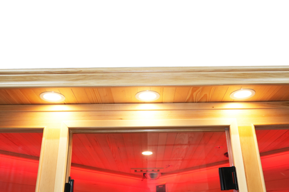 Warm LED ceiling lighting illuminating the interior of the Blisspod Vienna RED sauna
