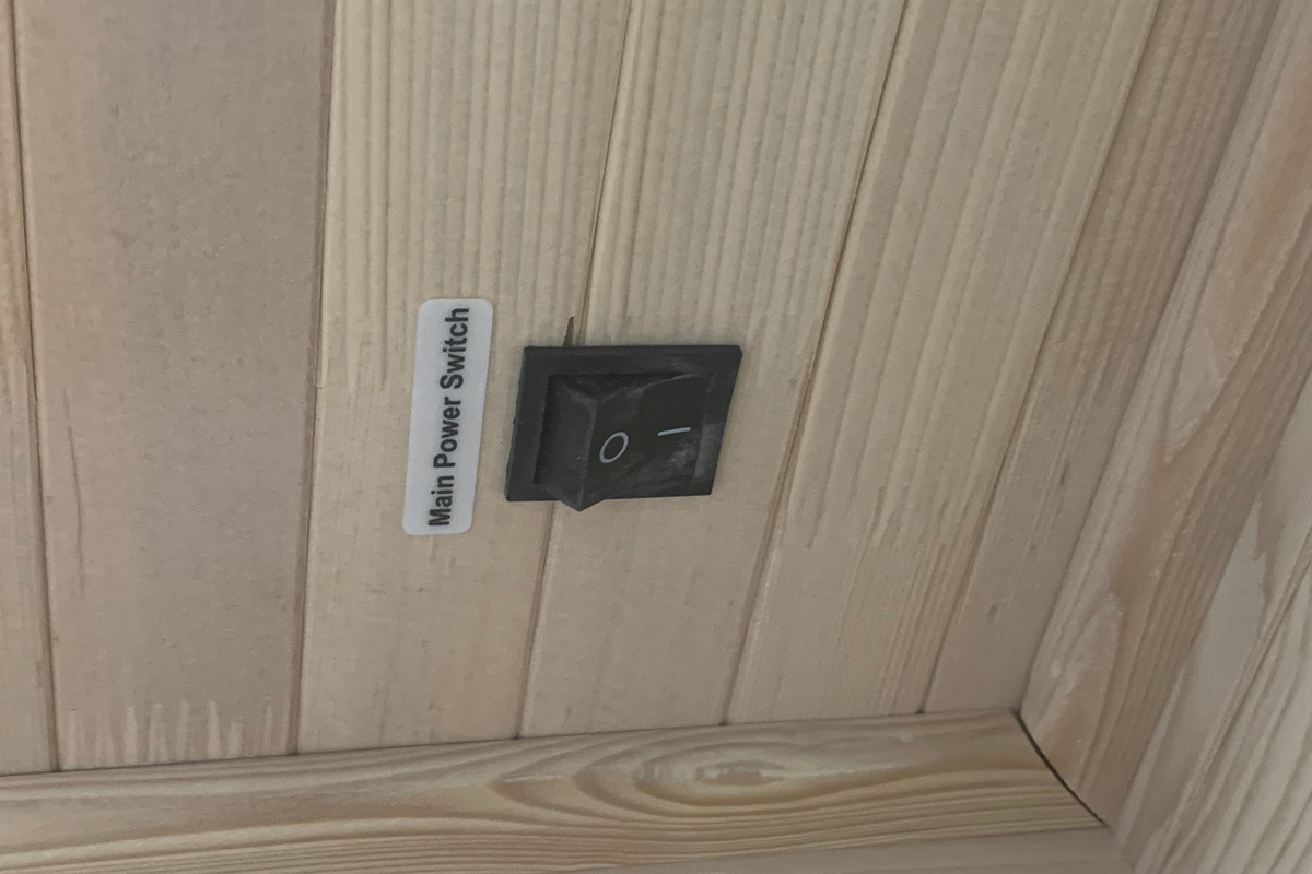 Close-up of the power switch inside the Blisspod Vienna 1-person far infrared sauna