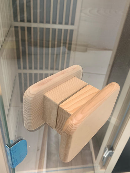Close-up of wooden sauna accessories and interior details
