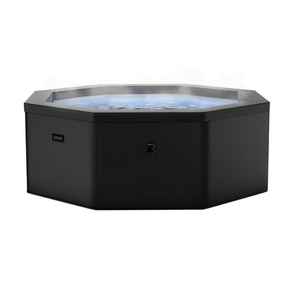 Como 6-person octagonal foam hot tub in Charcoal with cover removed and bubbling water visible