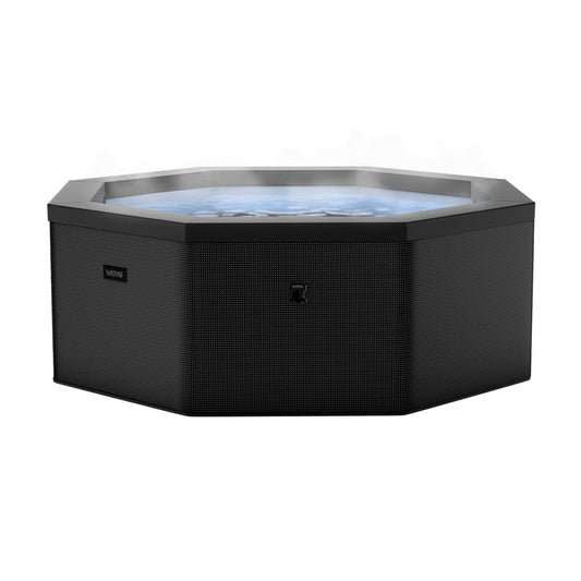 Como 6-person octagonal foam hot tub in Charcoal with cover removed and bubbling water visible