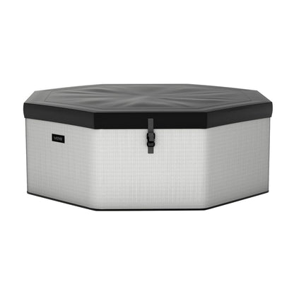 Como 6-person octagonal foam hot tub with light gray exterior and dark cover secured over the top