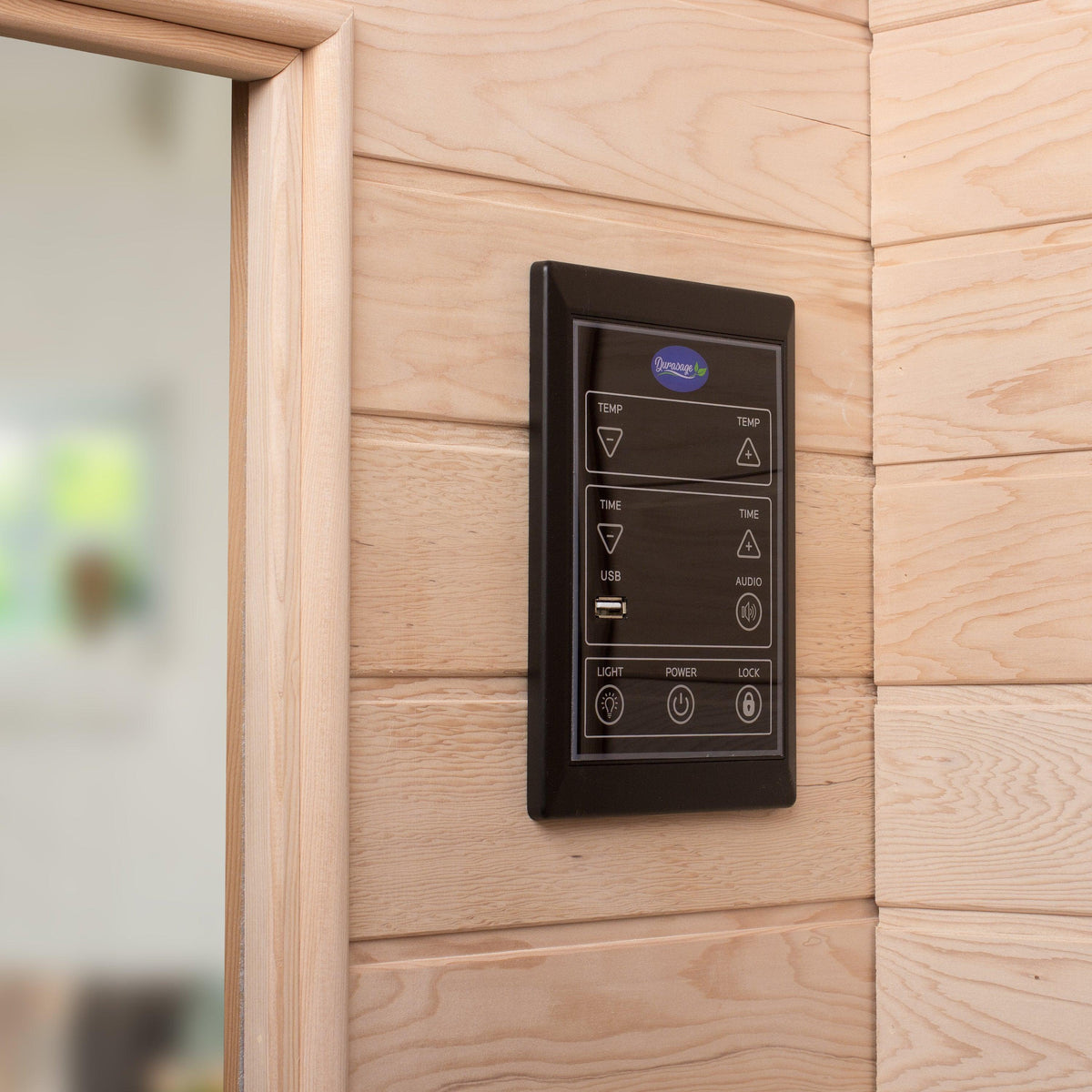 Close-up of exterior control panel mounted on the wooden wall of the Durasage infrared sauna