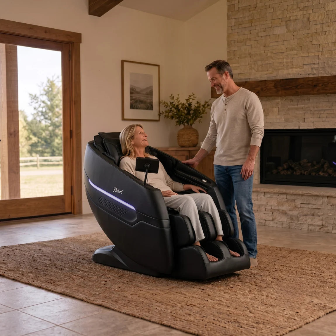 Woman seated in Floridian Rebel 4D massage chair with man standing beside her in a home setting