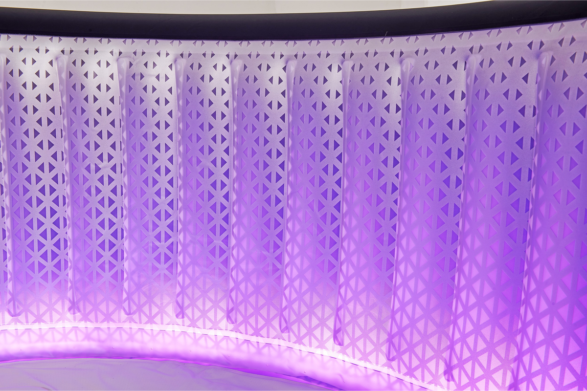 Close-up of purple LED lighting shining through the MSpa AURORA spa wall
