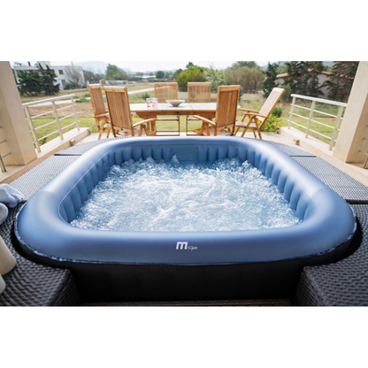 MSpa Tekapo inflatable hot tub on an outdoor deck with bubbles across the water